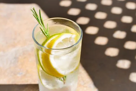 Summer refreshing lemonade on light brown table, closeup Stock Photos