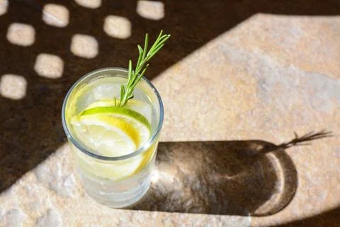 Summer refreshing lemonade on light brown table, space for text Stock Photos