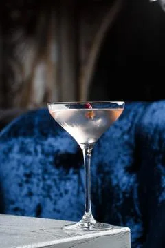 Summer refreshment drinks. Light pink rose cocktail, with rose wine on dark b Foto stock