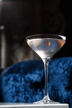 Summer refreshment drinks. Light pink rose cocktail, with rose wine on dark b Stock Photos