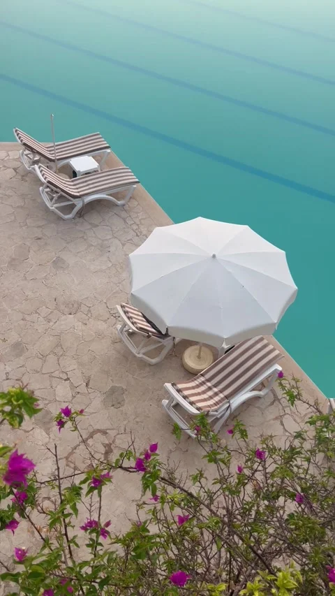 Summer resort with pool in front of the sea Stock Footage 336904928