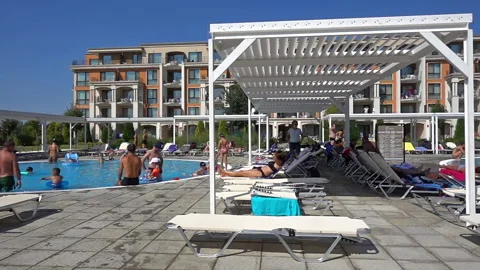 Summer resort with slide and pool, people having fun on a sunny day Stock Footage 150211457