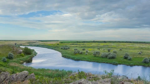 Summer river flow among stony coast at summer day Stock Footage 231991336