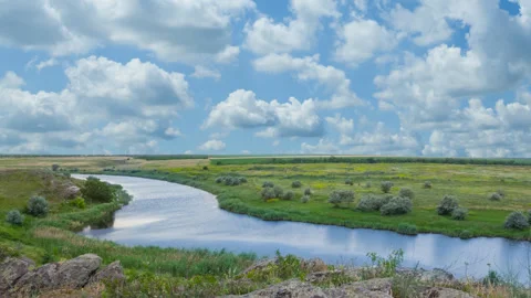 Summer river flow among stony coast at summer day Stock Footage 313933214