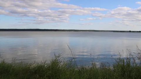 Summer, river, grass, sky and clouds Stock Footage 119873286