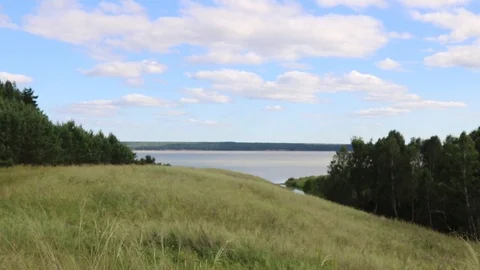 Summer, river, grass, sky and clouds Stock Footage 119873513