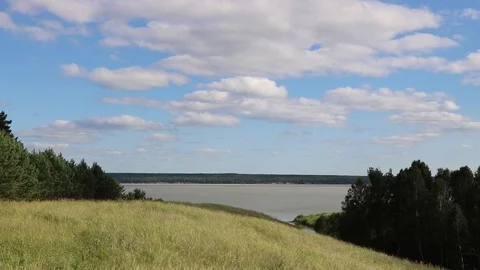 Summer, river, grass, sky and clouds Stock Footage 119873563