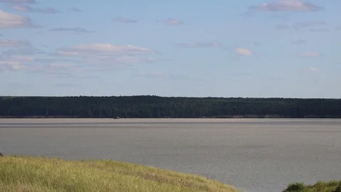 Summer, river, grass, sky and clouds Stock Footage 119873576