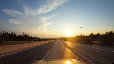 Summer road trip in evening, first-person view of a moving car on a highway Stock Footage 124824662
