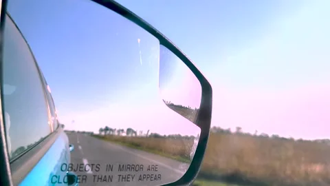 Summer road trip. View in the rear view mirror of a car. Road trip. Summer car Video stock 261220146