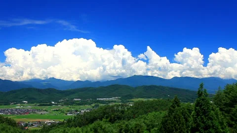 Summer Salt Fields Overlooking Asama Mountain, Yatsugatake Mountain, and Vídeo Stock 330295339