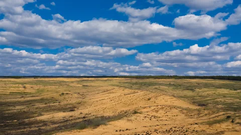Summer sandy desert under a dense cloudy sky time lapse scene Stock Footage 288064935