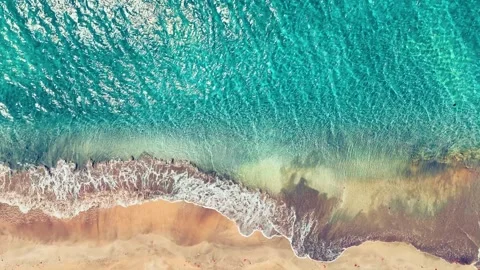 Summer sandy sea beach with waves as background with aerial drone view. Stock Footage 311996306