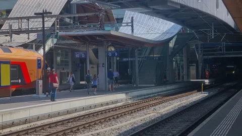Summer scene at Bern Central Station, Switzerland, as commuters and travelers Stock Footage 346005300