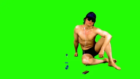 Summer season. Sunbathing athletic guy on a green background. Stock Footage 106950220