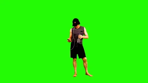 Summer season. Sunbathing athletic guy on a green background. 스톡 동영상 107800928