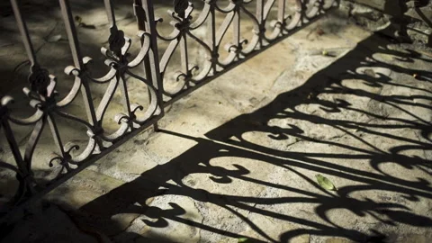 Summer shadows from old garden gate on flagstones Stock Footage 141617002