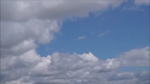 Summer sky time lapse, sun shining and moving clouds,  airplane passing b Stock Footage 63130663