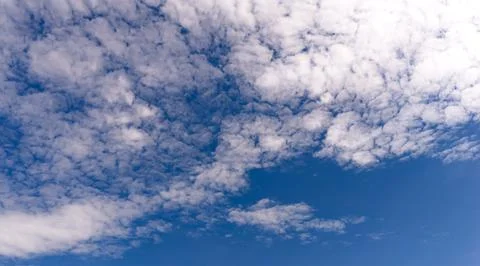 Summer sky with white clouds. Blue sky fills cloudscape clouds. Open sky gi.. Stockfoto's