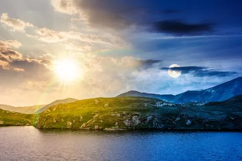 Summer solstice scenery of alpine capra lake with steep slopes Foto stock