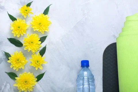 Summer spring flatlay composition yoga mat and bottle of water Stock Photos