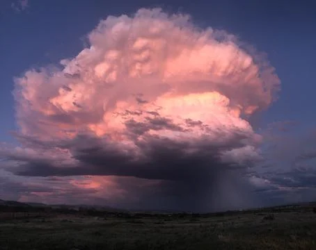 Summer Storm Cloud at Dusk Stock Photos