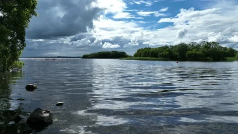Summer stormclouds over lake Stock Footage 199286649