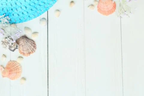 Summer straw hat and seashells on a wooden background.photo with place for text Stock Photos