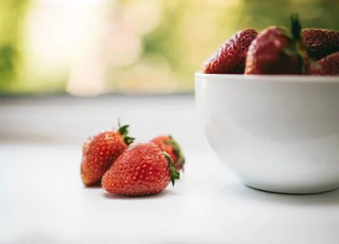 Summer strawberries in a white plate Stock Photos