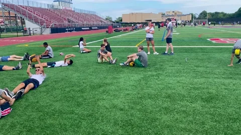 Summer strength and agility camp with high school kids on a turf field 3153 Stock Footage 201309685