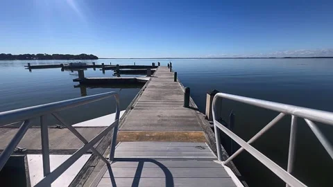 Summer Stroll on a Dock Overlooking the Lake Stock Footage 295517277