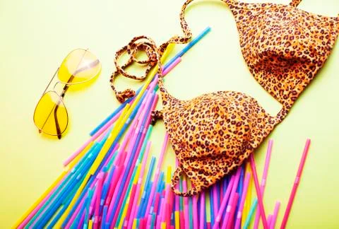 Summer stuff on yellow background close up top view Stock Photos