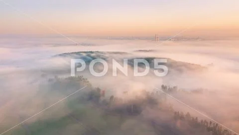 Summer sunrise and morning fog. Minsk city on background Stock Photos