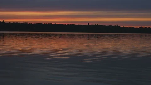 Summer sunset on the background of a calm river Stock Footage 117515777