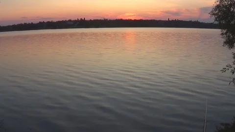 Summer sunset on the background of a calm river Stock Footage 119283070