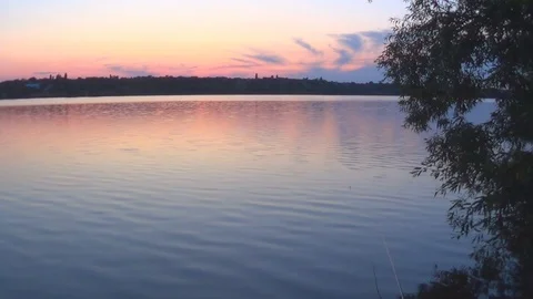 Summer sunset on the background of a calm river Video stock 119283144