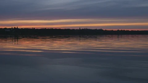 Summer sunset on the background of a calm river Stock Footage 119283352
