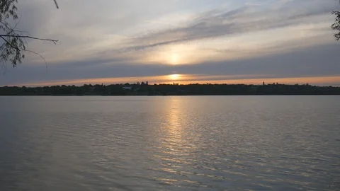 Summer sunset on the background of a calm river Video stock 119703076