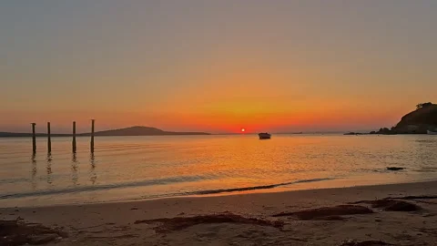 Summer Sunset Beach Background with Calm Sea and Fishing Boat 库存影片 335699236