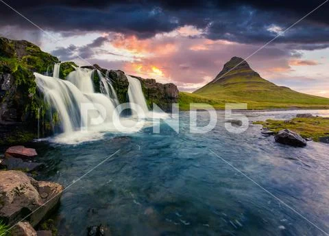 Summer sunset on famous Kirkjufellsfoss Waterfall Stock Photos