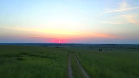 Summer sunset in the field . Evening light. The video is above the field. 4K Video stock 156450779