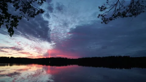 Summer sunset over calm lake in pictorial sky with clouds Stockbeeldmateriaal 101049920