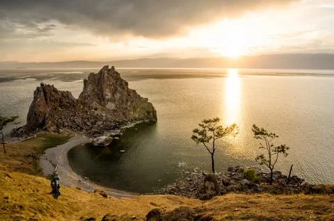 Summer sunset over Rock of Shamanka Burhan on Olkhon Island in Lake Baikal Stock Photos