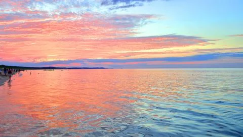 A summer sunset scenery on the horizon. Stock Photos