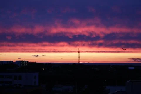 Summer sunset in the town Stock Photos
