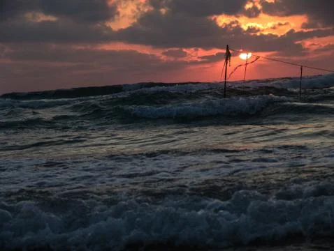 Summer sunset view of a beach under a cloudy sky Foto stock