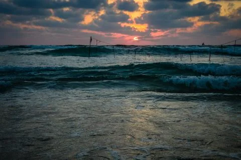 Summer sunset view of a beach under a cloudy sky Foto stock