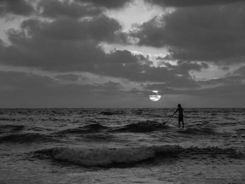 Summer sunset view of a beach under a cloudy sky 写真素材