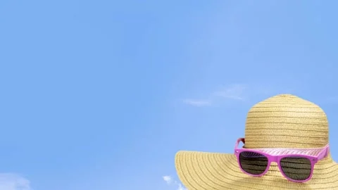 Summer sunshine straw hat in blue sky on a sunny day.Holiday,travel, Stock Footage 234179921