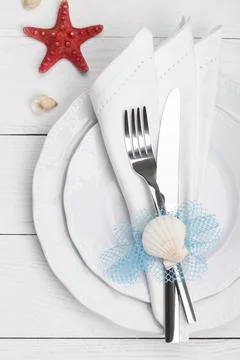 Summer table setting, holiday background concept with sea shells copy space Stock Photos